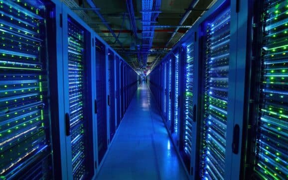 What is the 100 MW rule, and why are future US data centers moving to liquid cooling by July